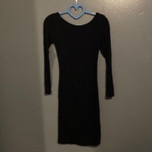 Black dress with an open low back, I’m a medium and it fit me. Best judgement!